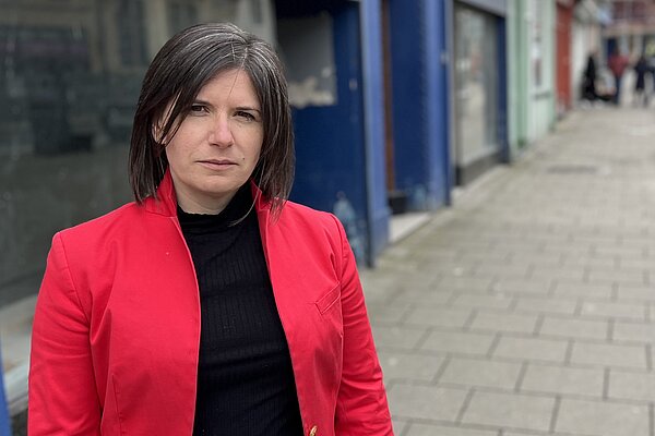 Sandra Jervis standing outside empty shops in Aberystwyth