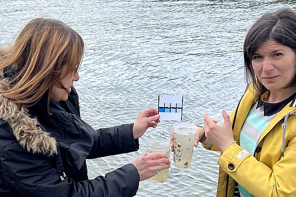 Sandra Jervis and Jane Dodds testing a water sample in Aberystwyth harbour